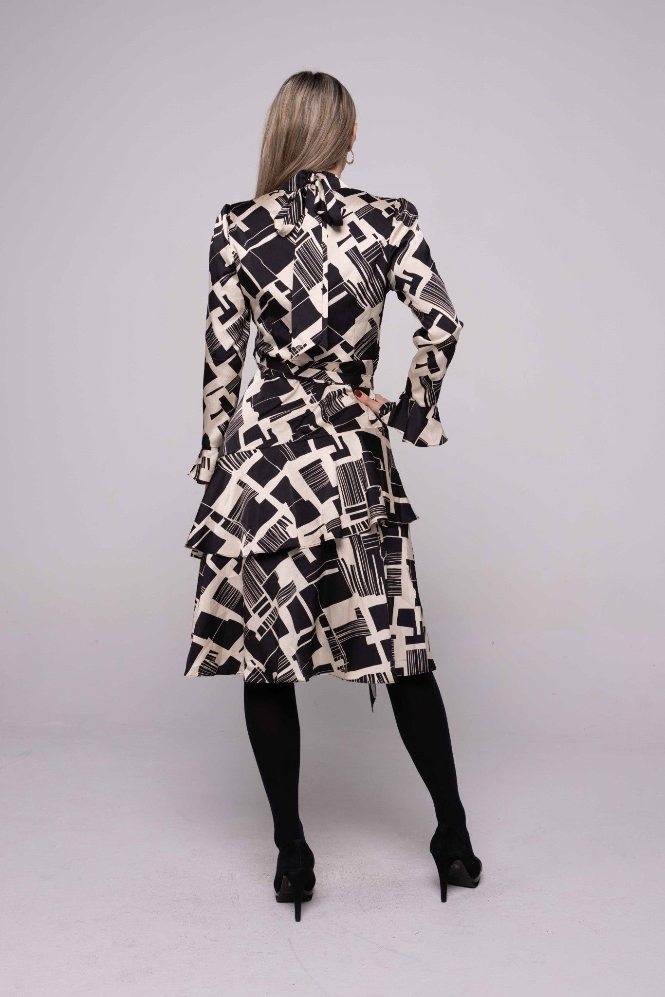 GEOMETRIC PRINT DRESS WITH LAYERED SKIRT AND TIE BACK